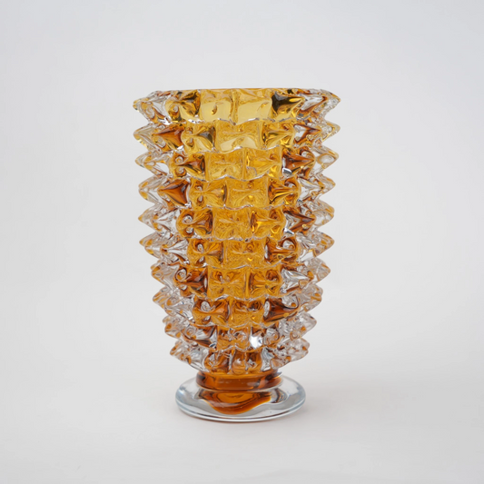 Textured glass vase with a rough matte finish, featuring an organic rounded shape and distressed surface, designed as a modern decorative piece for home interiors and styling.