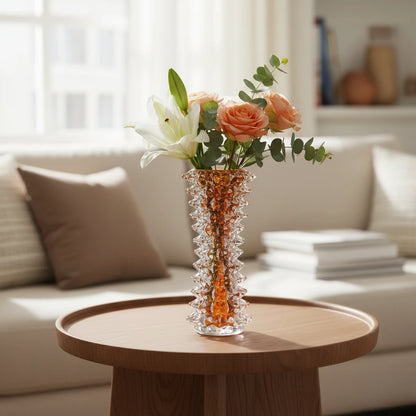 Tall glass vase with a textured distressed finish, featuring a tapered body and narrow neck, designed as a modern decorative piece for home interiors
