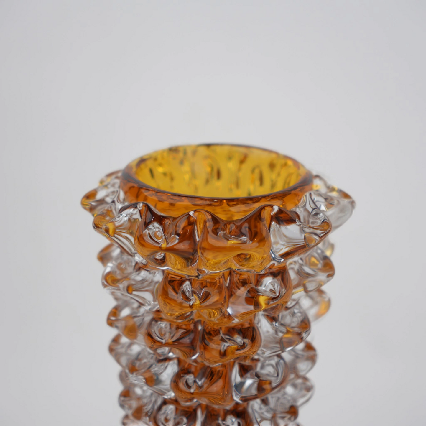 Tall glass vase with a textured distressed finish, featuring a tapered body and narrow neck, designed as a modern decorative piece for home interiors