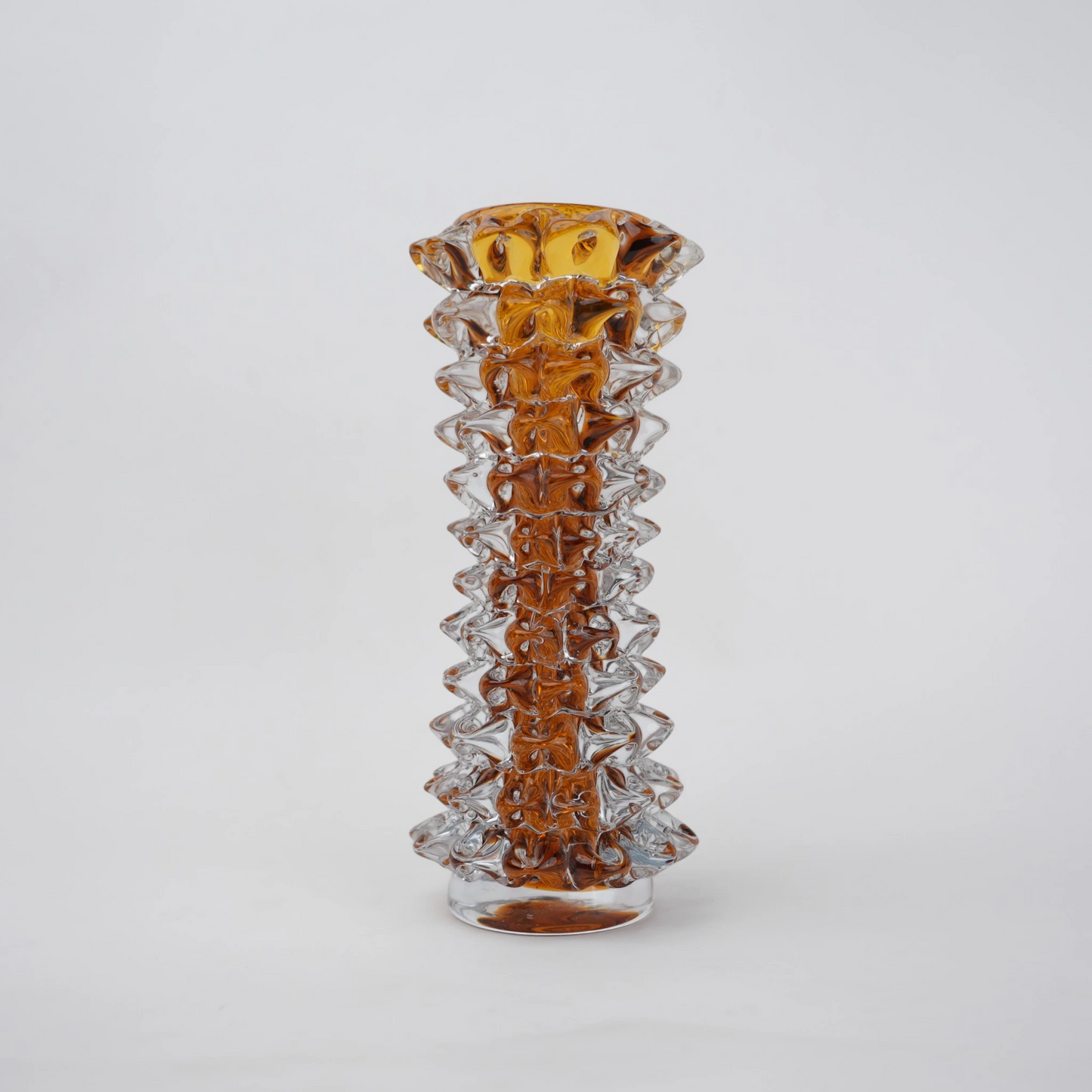 Tall glass vase with a textured distressed finish, featuring a tapered body and narrow neck, designed as a modern decorative piece for home interiors