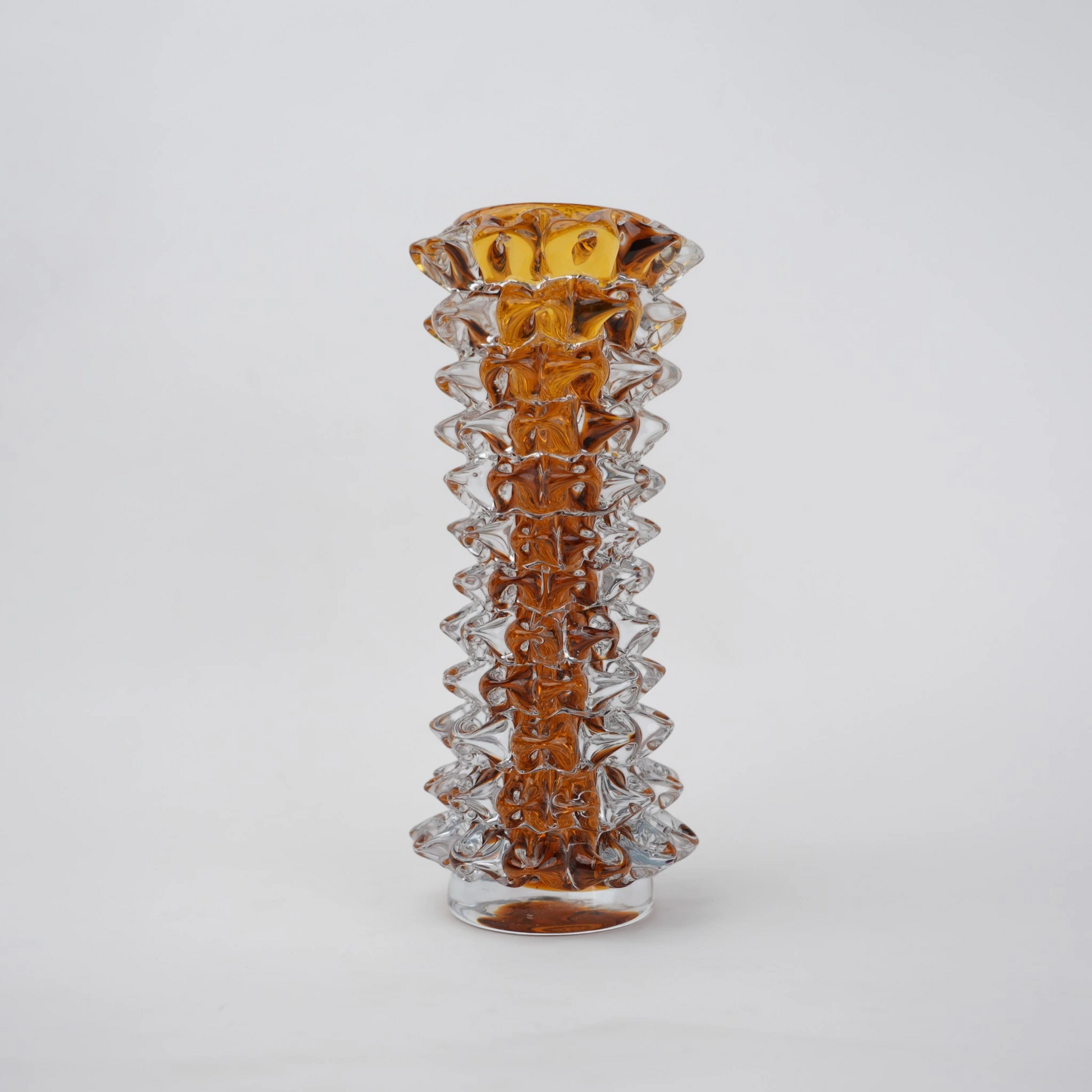 Tall glass vase with a textured distressed finish, featuring a tapered body and narrow neck, designed as a modern decorative piece for home interiors