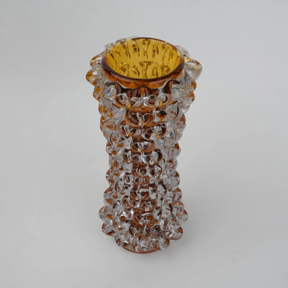 Tall glass vase with a textured distressed finish, featuring a tapered body and narrow neck, designed as a modern decorative piece for home interiors