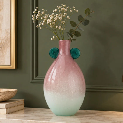 Vase with textured surface and green circular accents