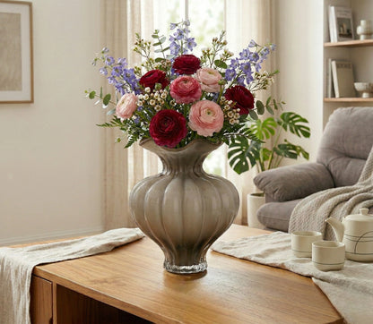 Ribbed glass vase with a smoky beige tint, featuring a rounded bulb shape and a wavy flared rim, designed as a modern decorative piece for home decor styling.