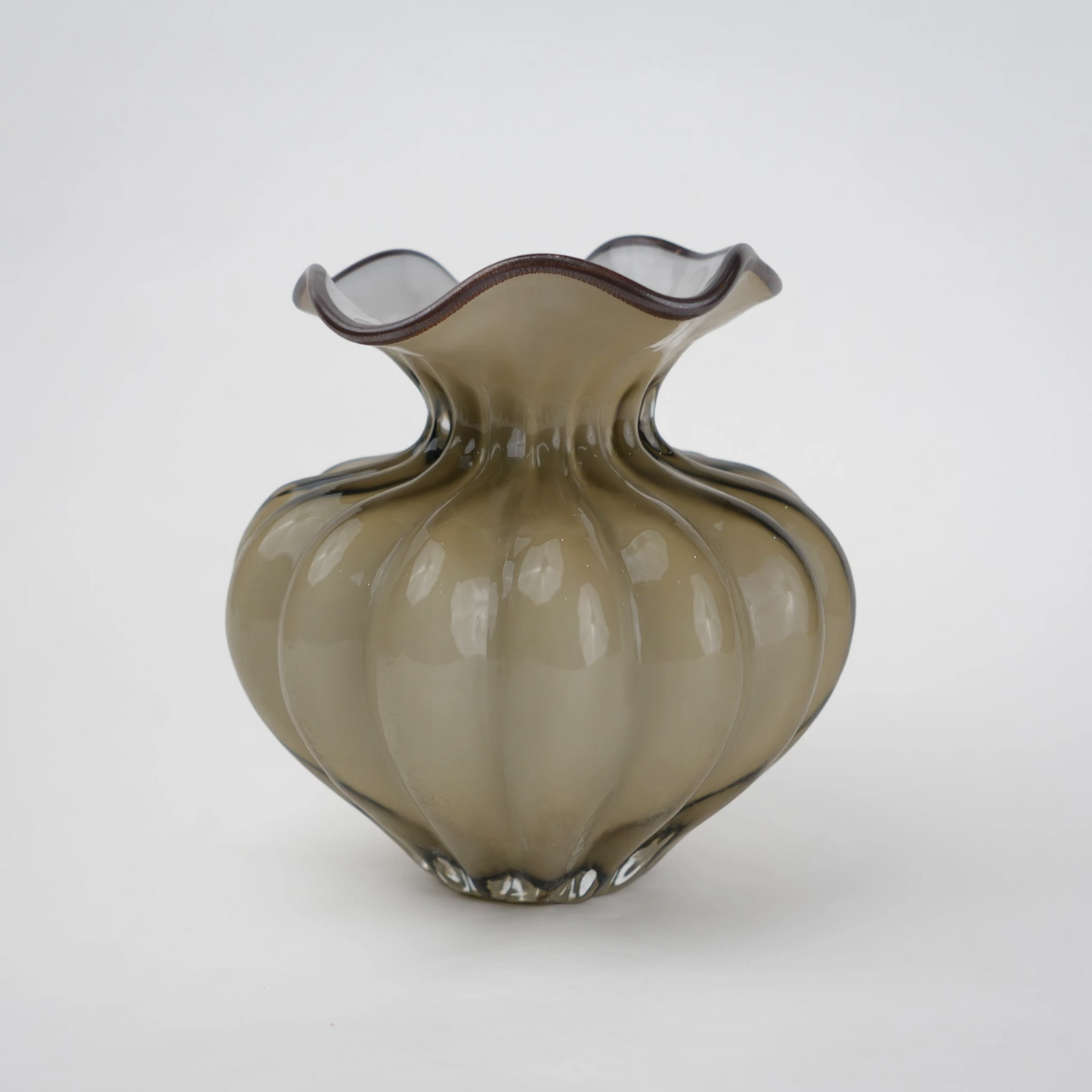 Ribbed glass vase with a smoky beige tint, featuring a rounded bulb shape and a wavy flared rim, designed as a modern decorative piece for home decor styling.