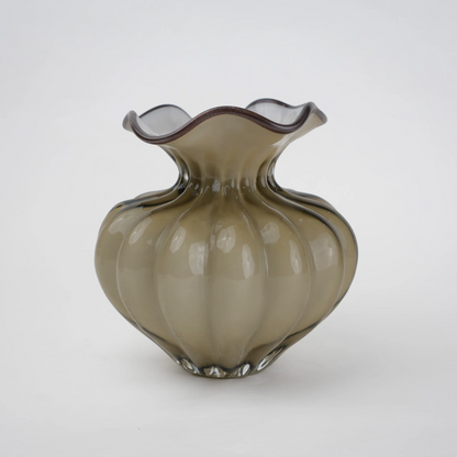 Ribbed glass vase with a smoky beige tint, featuring a rounded bulb shape and a wavy flared rim, designed as a modern decorative piece for home decor styling.