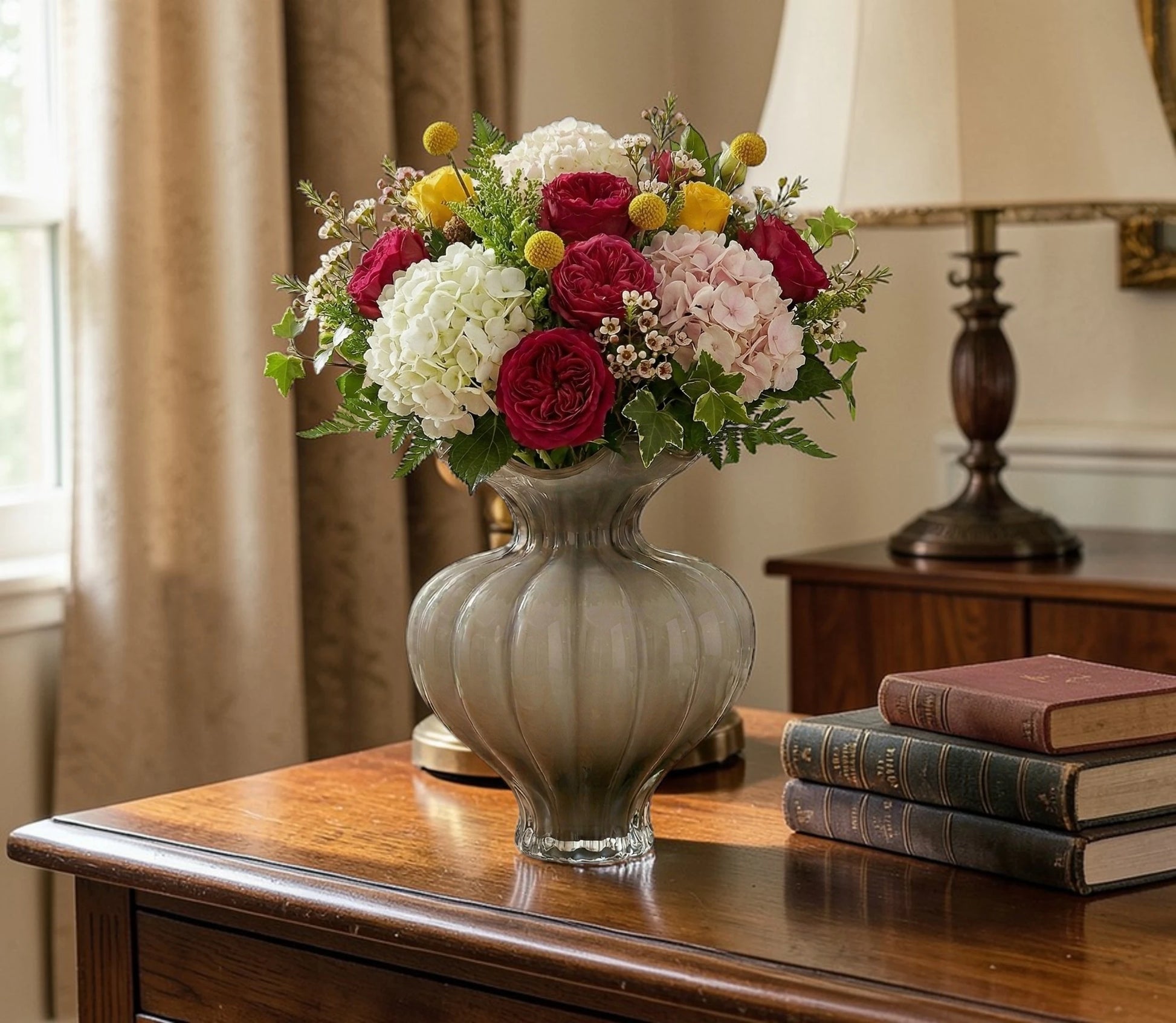 Ribbed glass vase with a smoky beige tint, featuring a rounded bulb shape and a wavy flared rim, designed as a modern decorative piece for home decor styling.