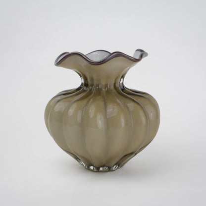 Ribbed glass vase with a smoky beige tint, featuring a rounded bulb shape and a wavy flared rim, designed as a modern decorative piece for home decor styling.
