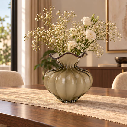 Ribbed glass vase with a smoky beige tint, featuring a rounded bulb shape and a wavy flared rim, designed as a modern decorative piece for home decor styling.