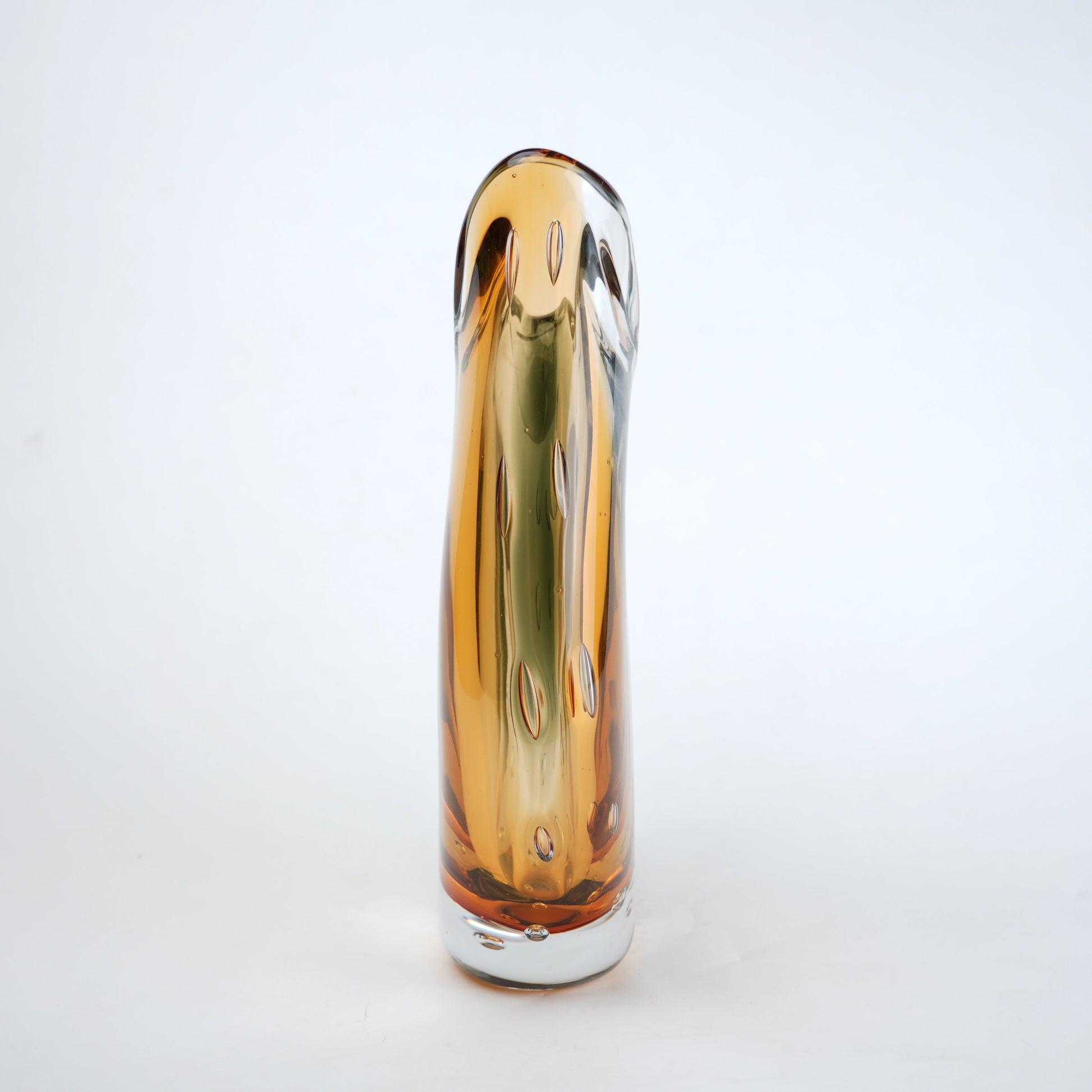 Tall, cylindrical glass vase with a gradient of brown and gold colors on a white background