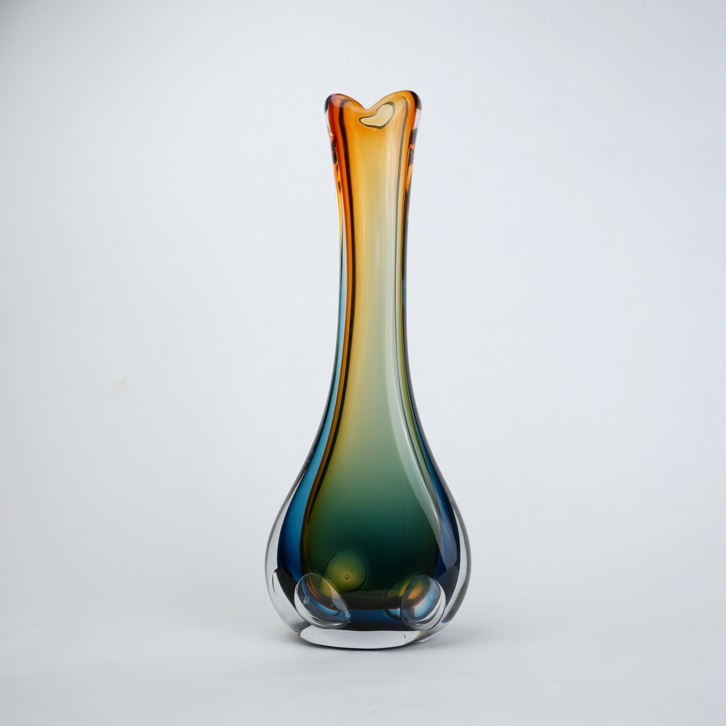 Gradient glass vase on a light gray background