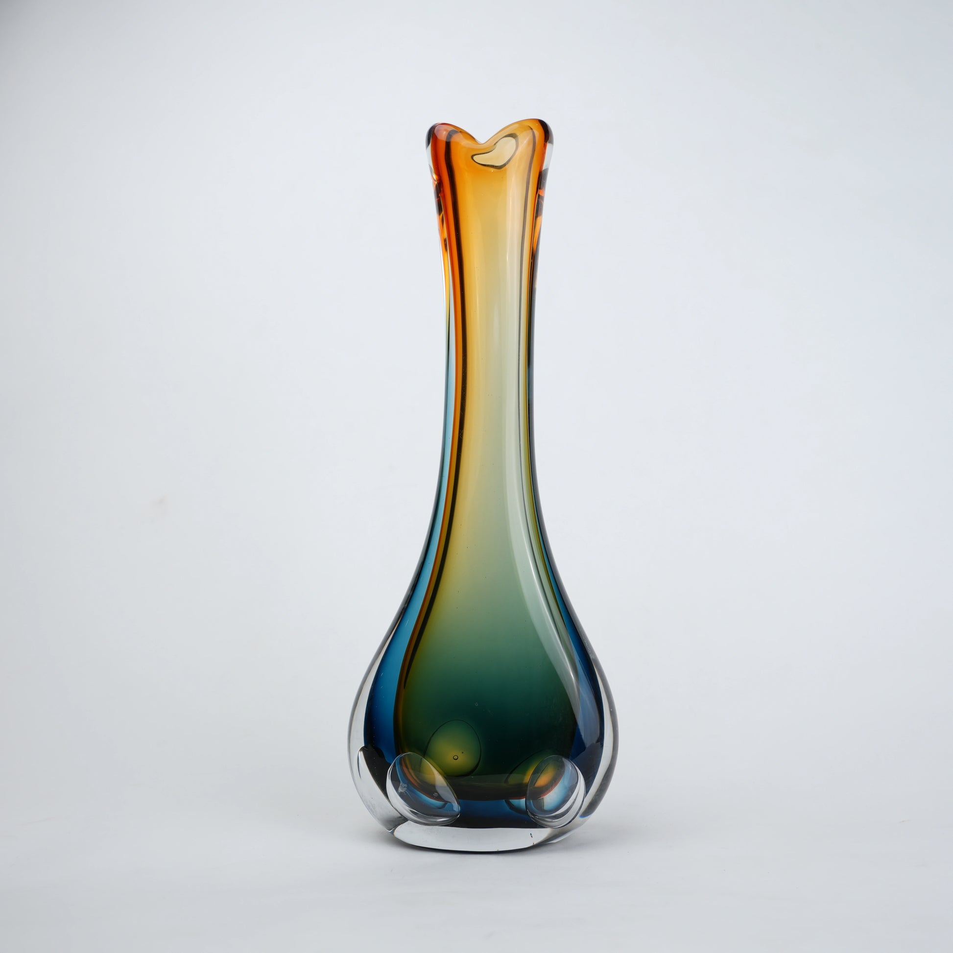 Gradient glass vase on a light gray background