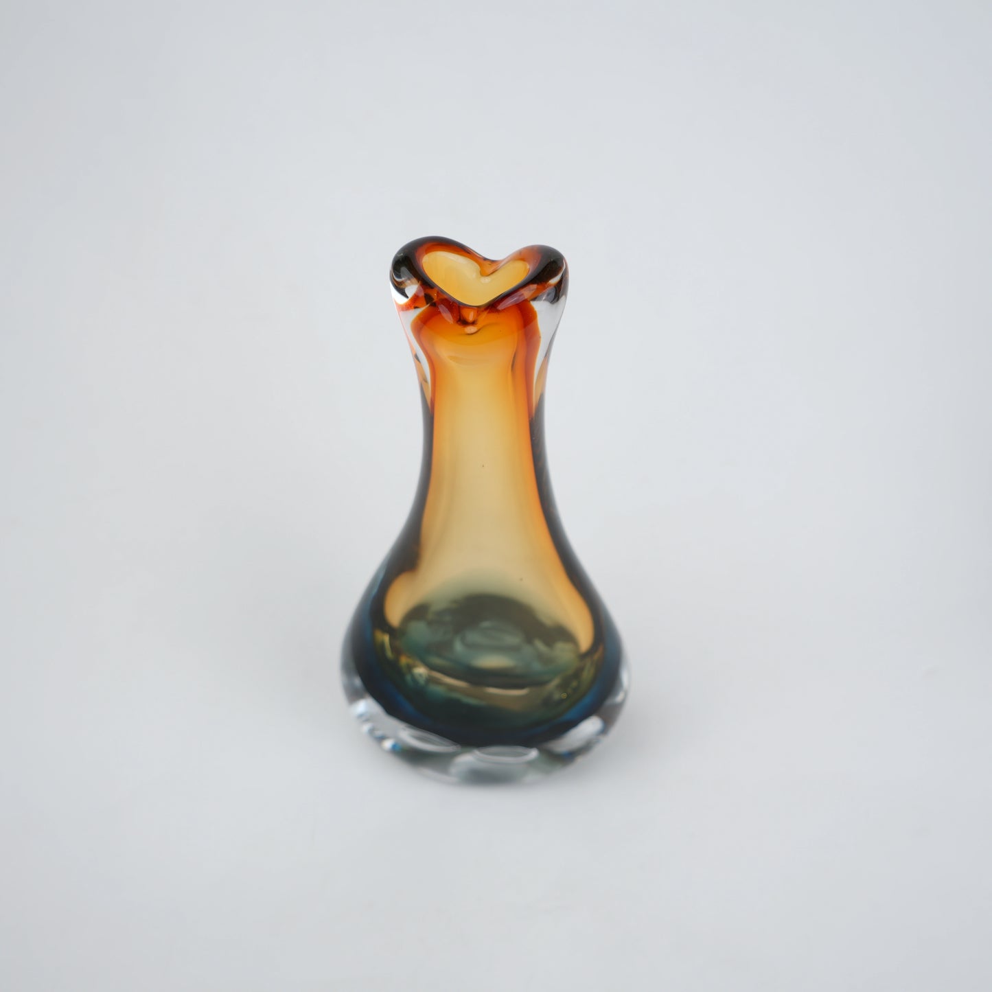 Glass vase with a unique design on a white background