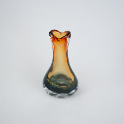 Glass vase with a unique design on a white background
