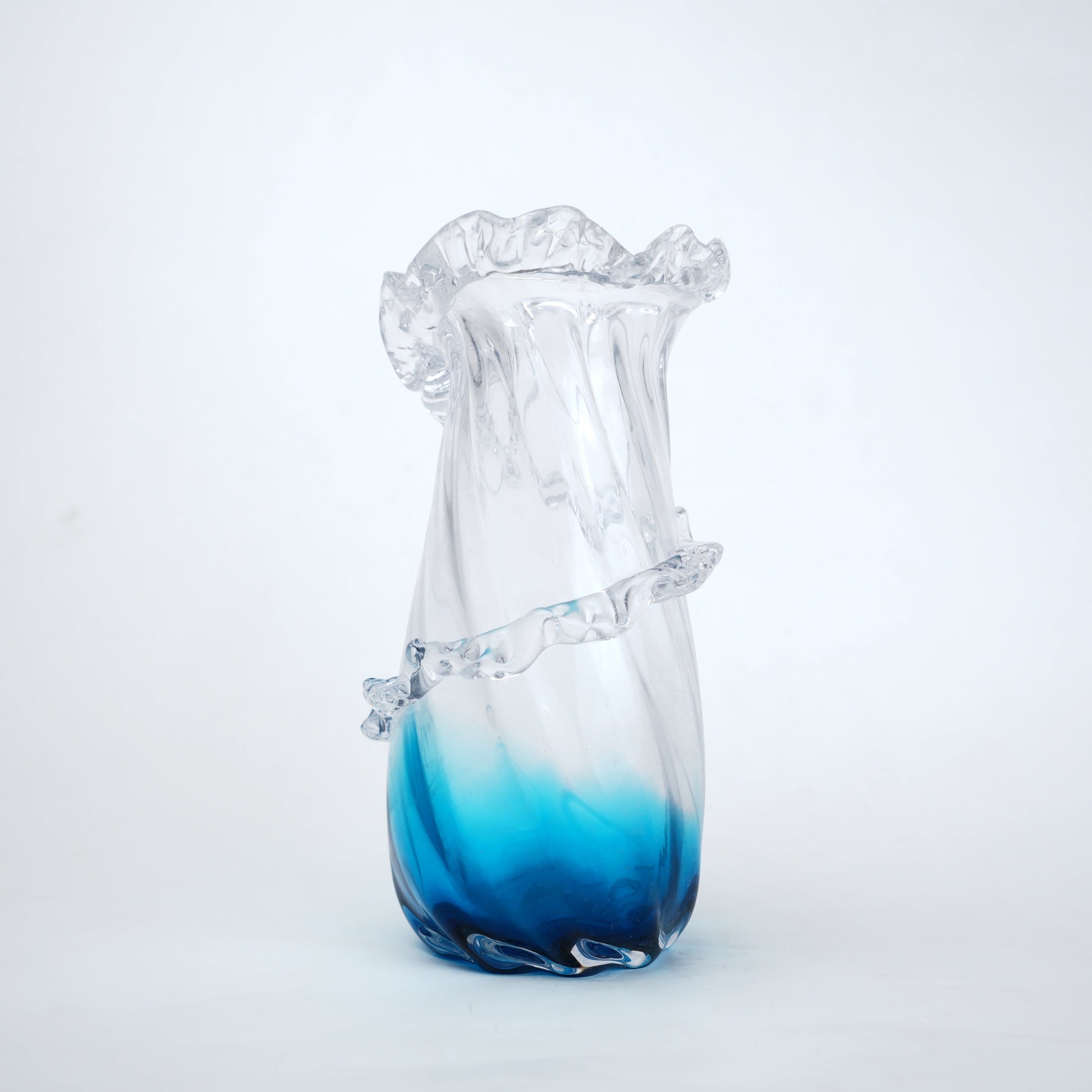 Glass vase with blue gradient on a white background