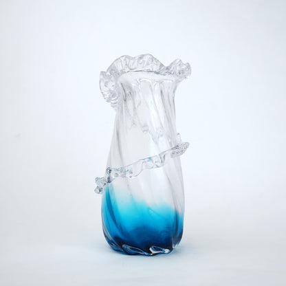 Glass vase with blue gradient on a white background