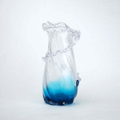 Glass vase with blue gradient on a white background