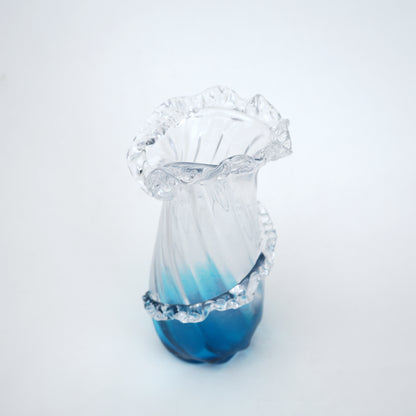 Glass vase with blue gradient on a white background