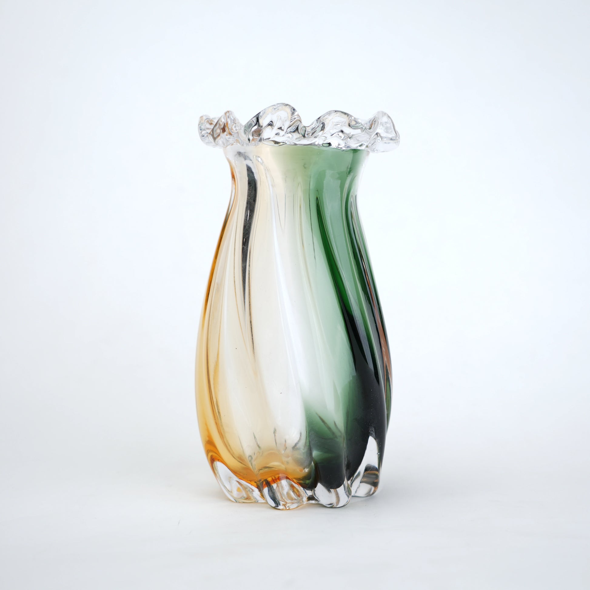 Multicolored glass vase with a white background