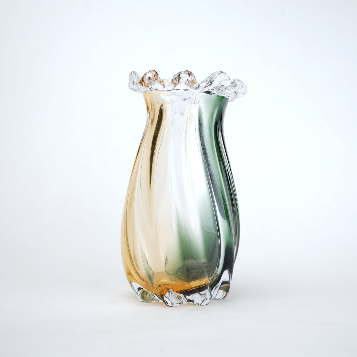 Multicolored glass vase on a white background