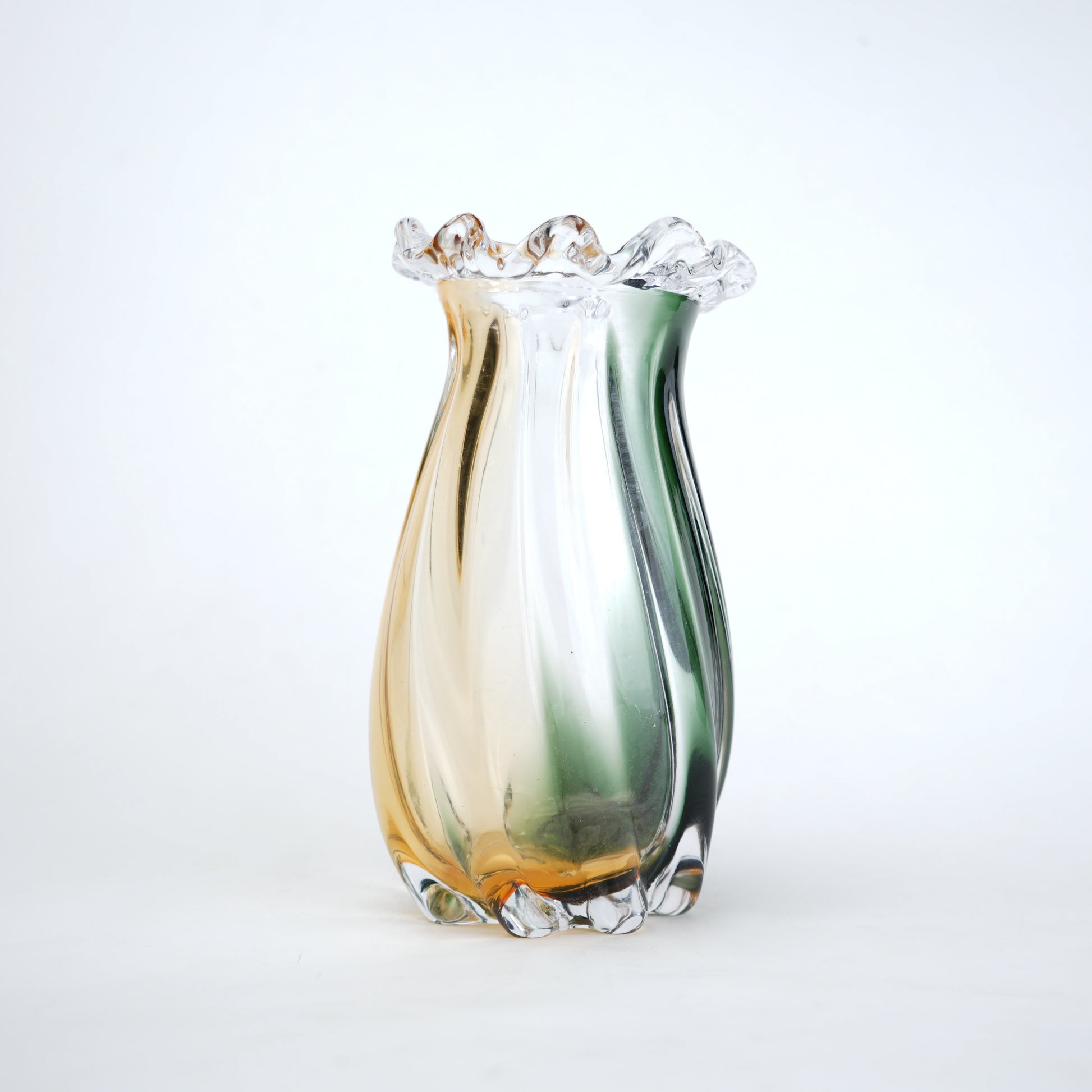 Multicolored glass vase on a white background