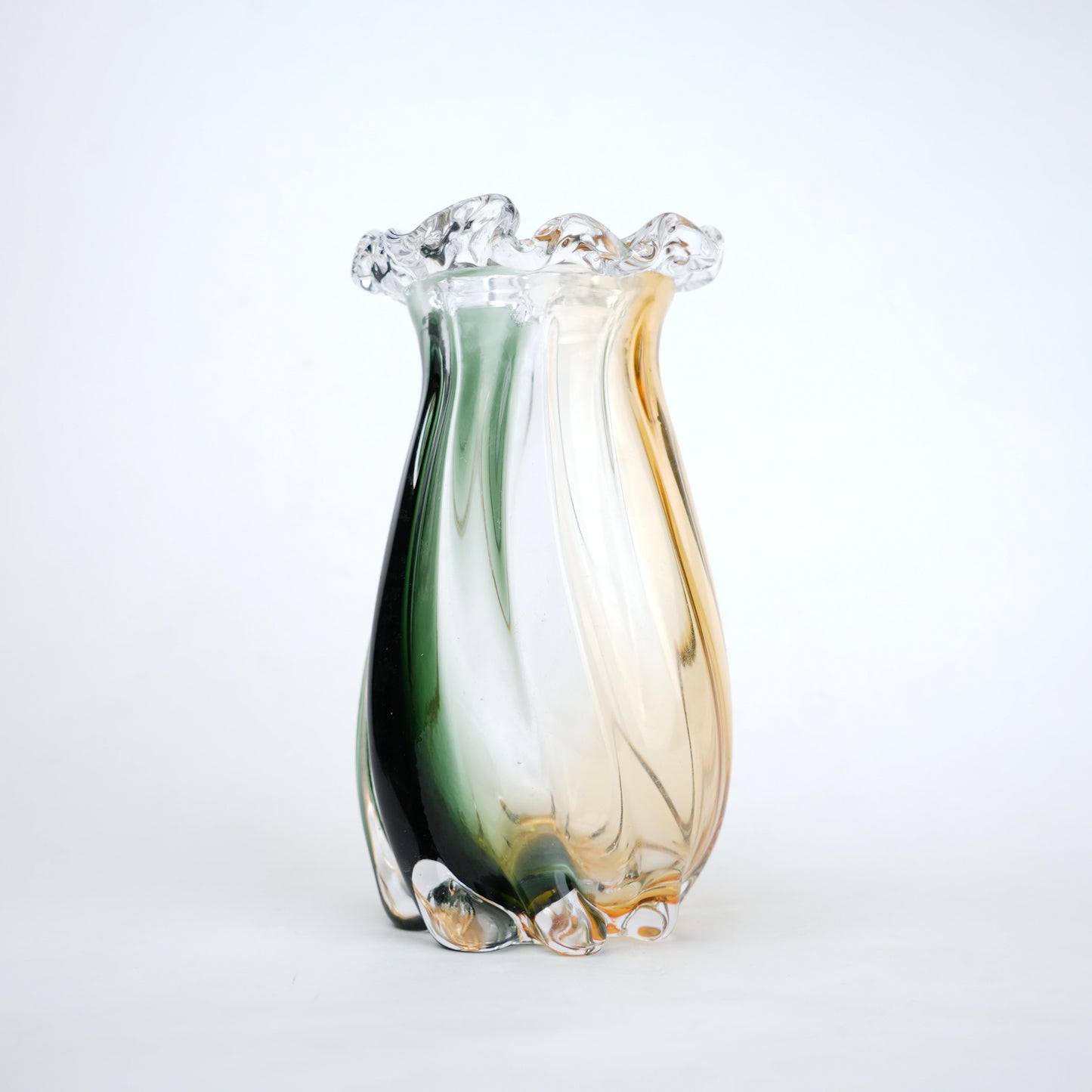 Multicolored glass vase on a white background