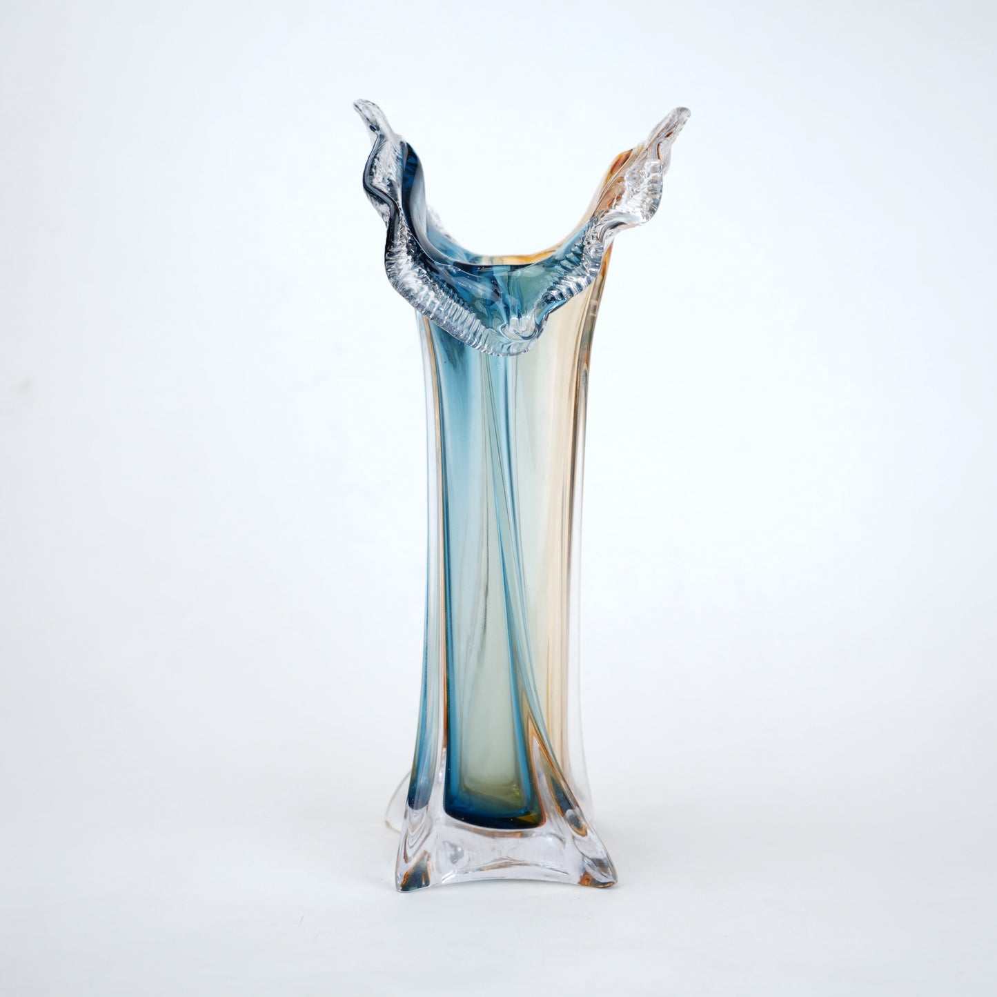 Dual tone blue and amber art glass vase with sculpted rim available in tall and small sizes