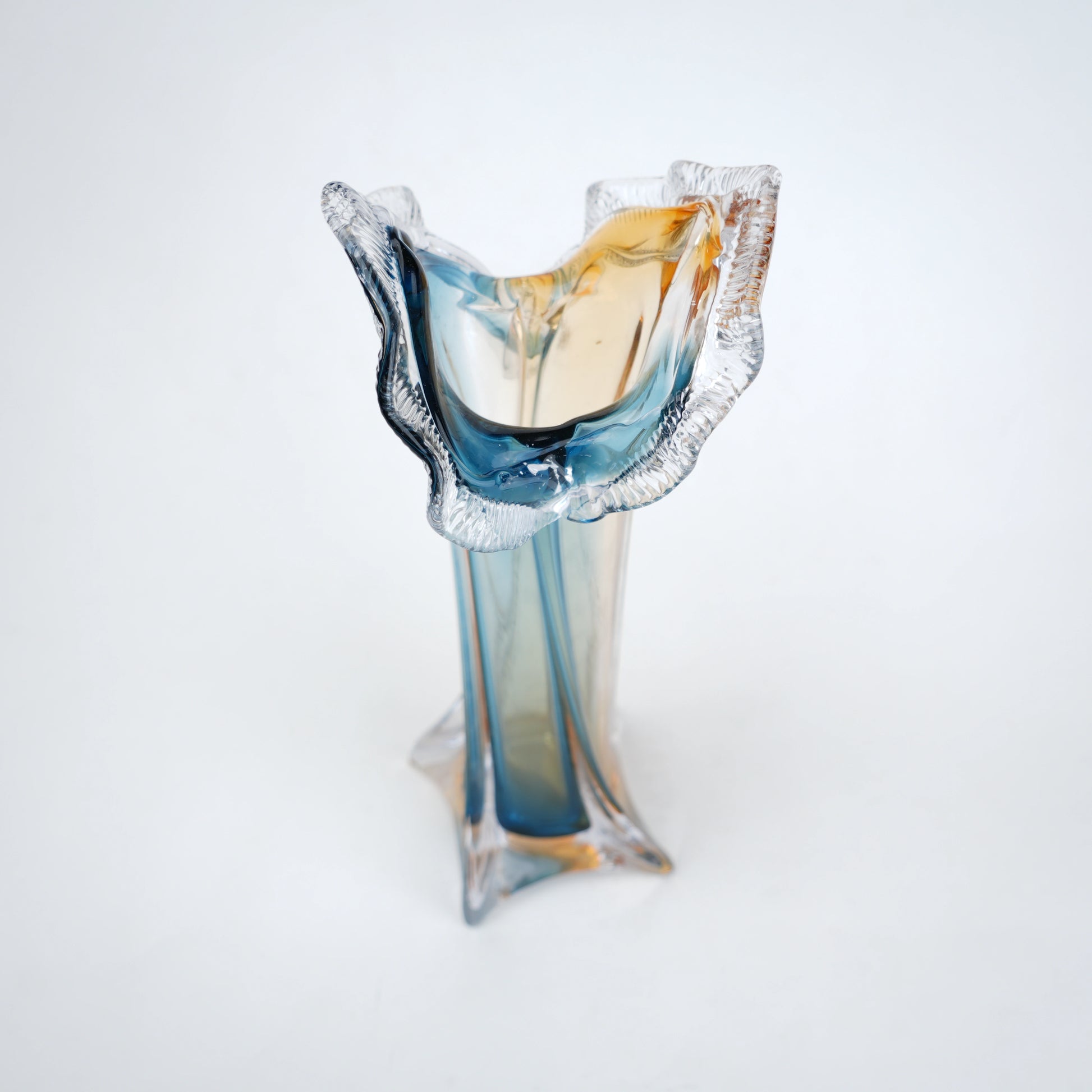 Dual tone blue and amber art glass vase with sculpted rim available in tall and small sizes