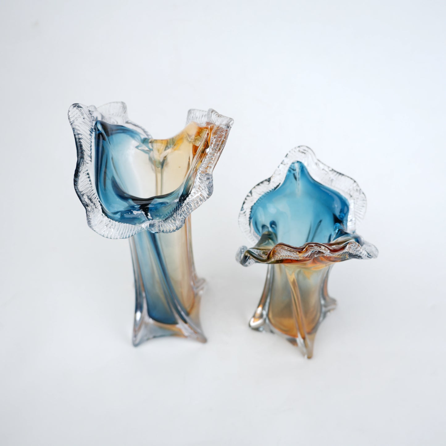 Dual tone blue and amber art glass vase with sculpted rim available in tall and small sizes