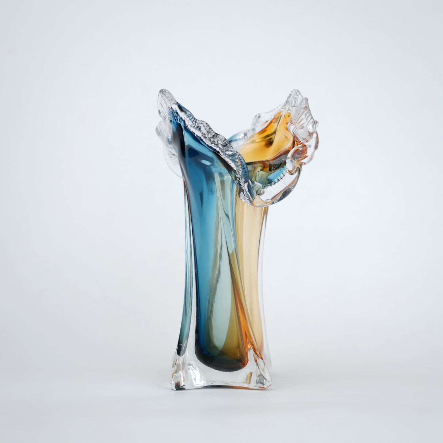 Dual tone blue and amber art glass vase with sculpted rim available in tall and small sizes