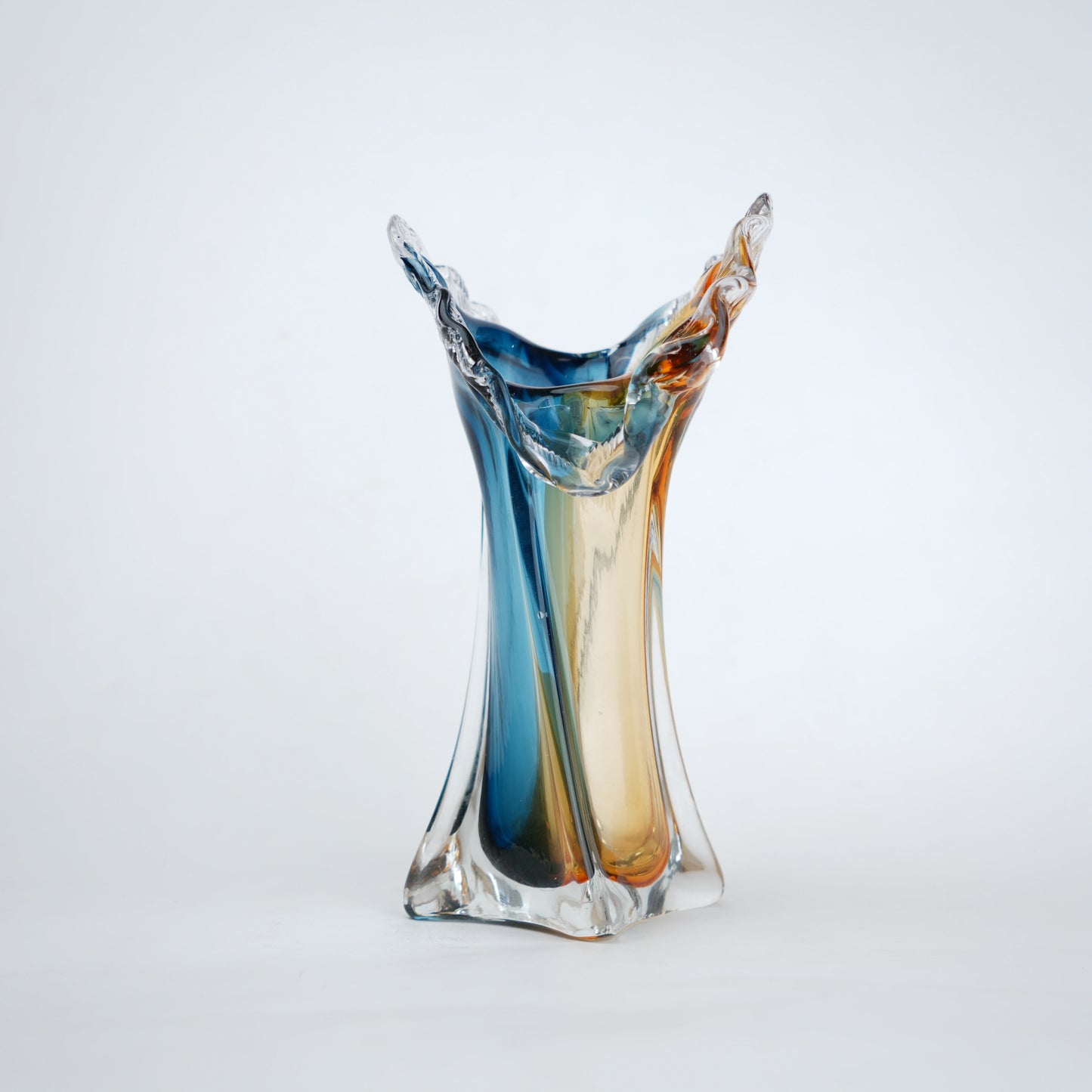 Dual tone blue and amber art glass vase with sculpted rim available in tall and small sizes