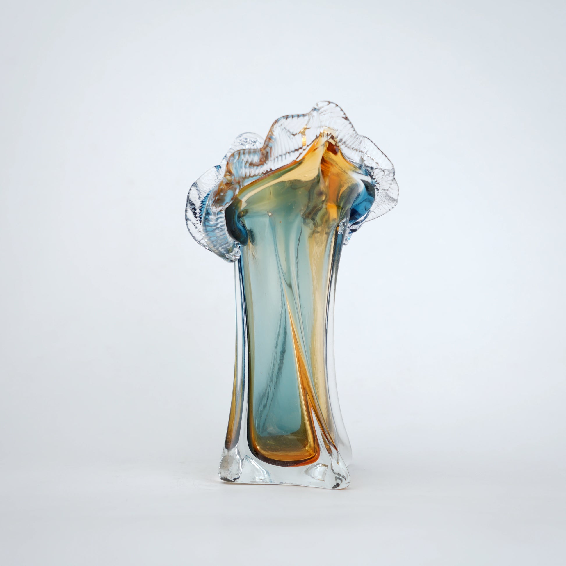 Dual tone blue and amber art glass vase with sculpted rim available in tall and small sizes