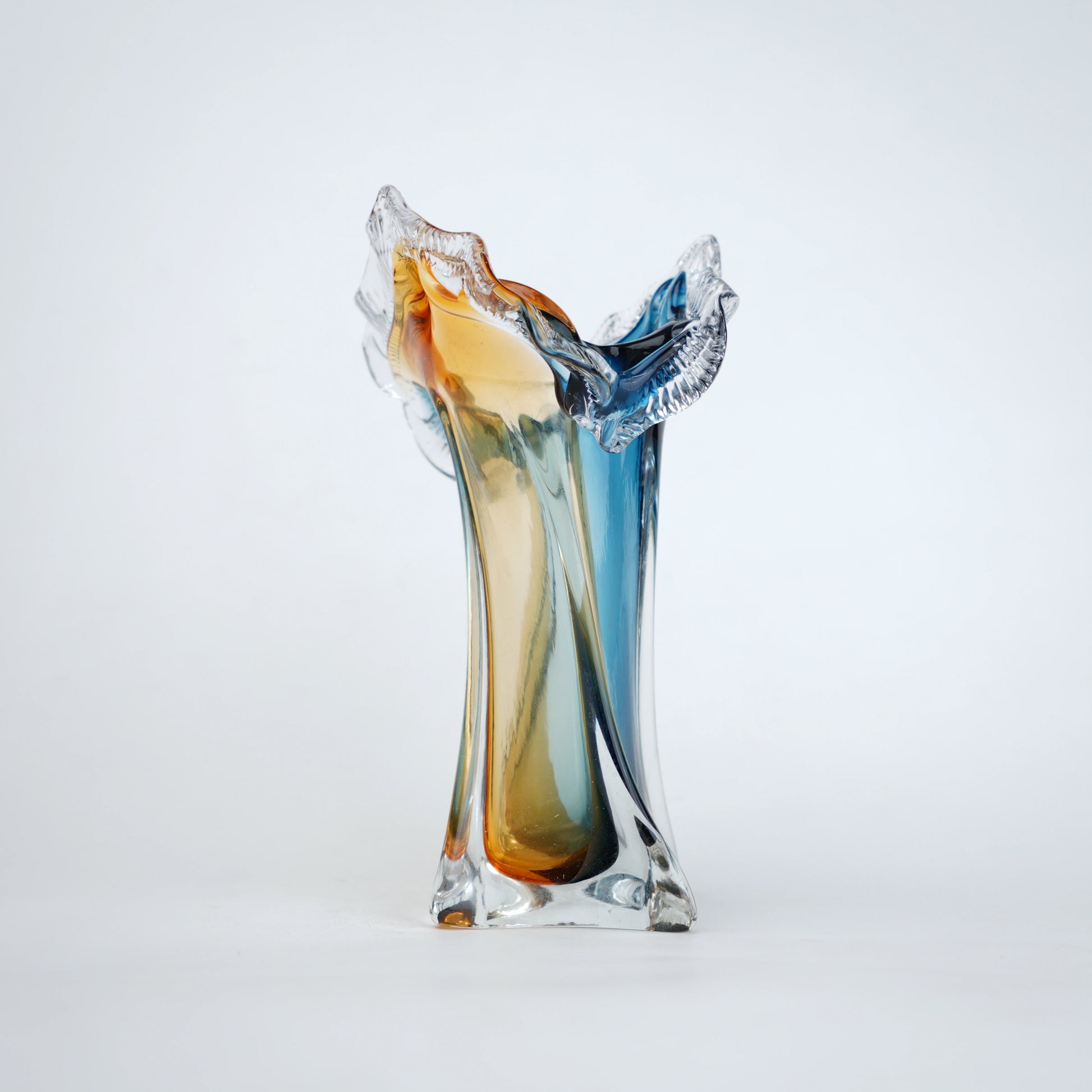 Dual tone blue and amber art glass vase with sculpted rim available in tall and small sizes