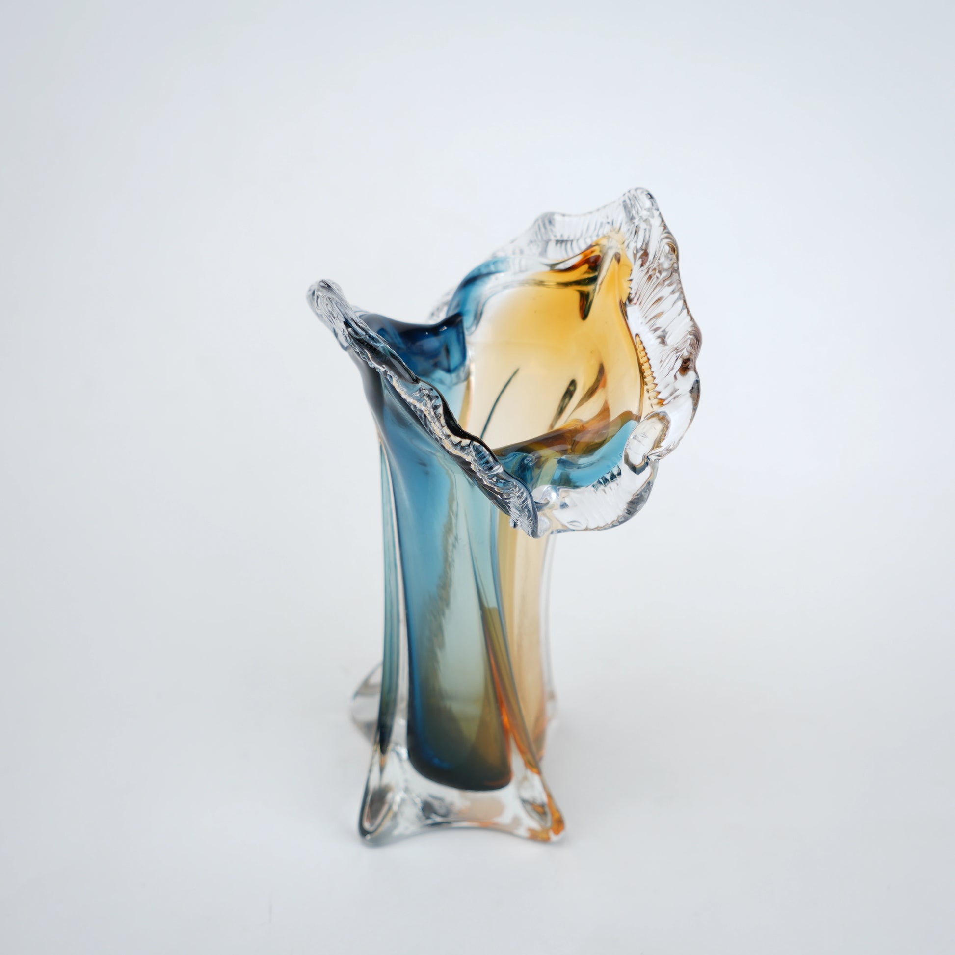 Dual tone blue and amber art glass vase with sculpted rim available in tall and small sizes