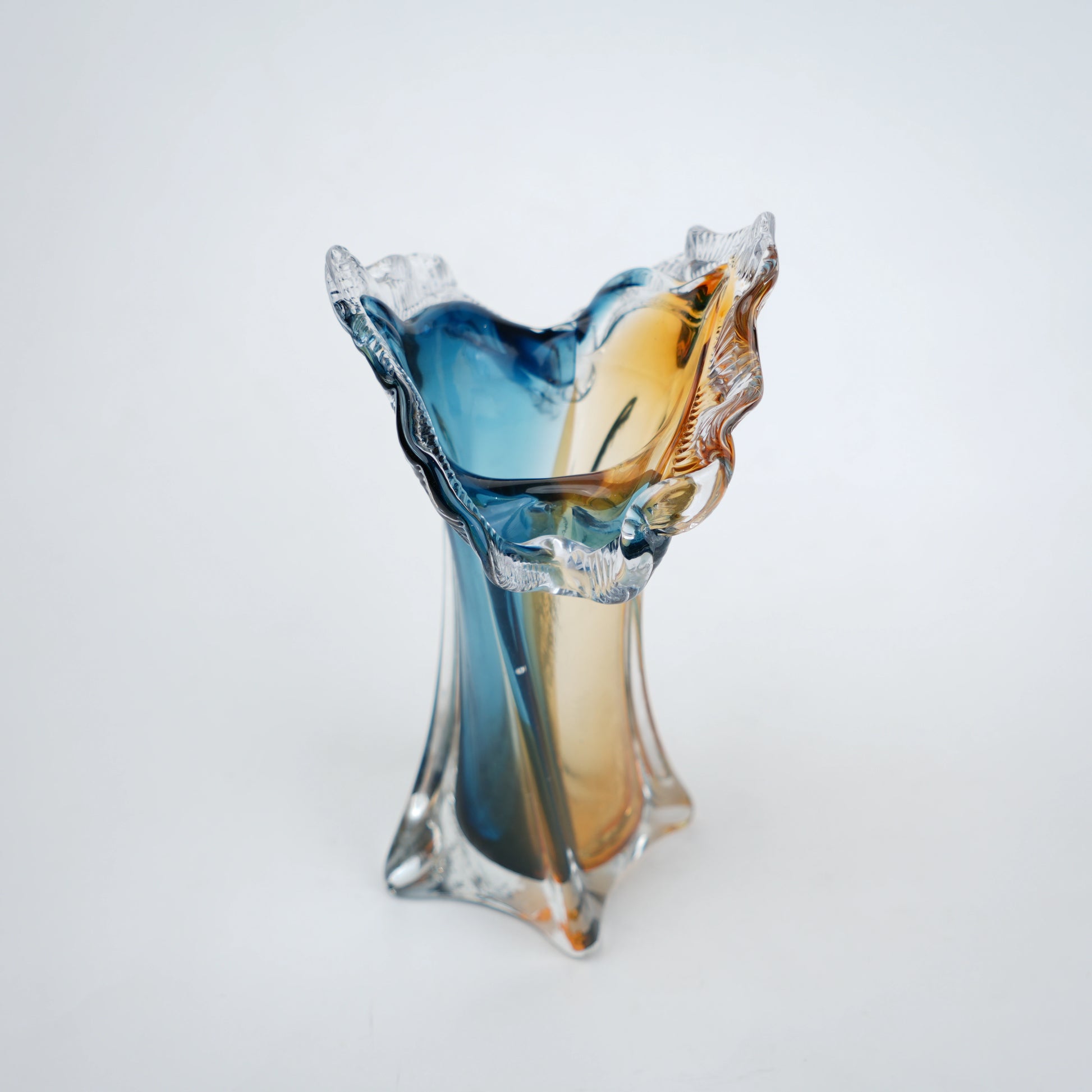 Dual tone blue and amber art glass vase with sculpted rim available in tall and small sizes