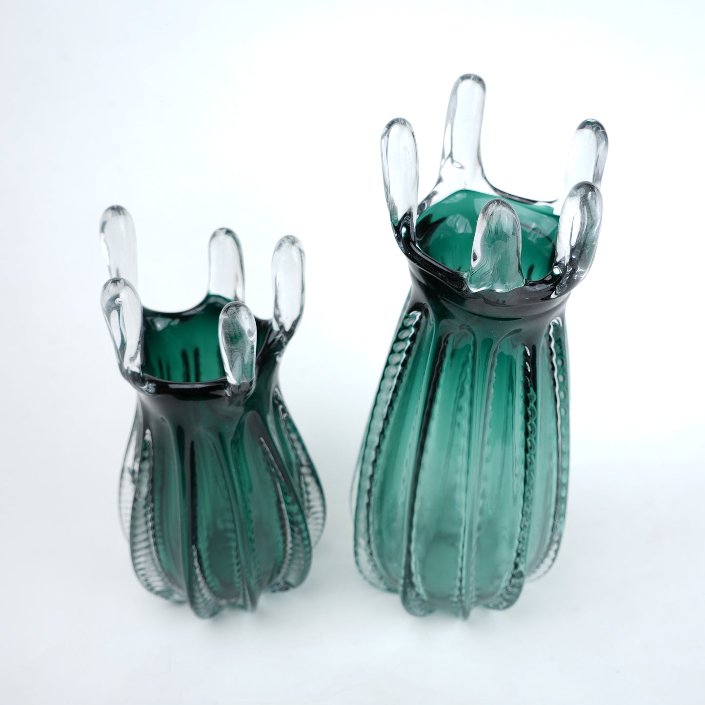 Emerald green glass vase with crown rim design available in small and big sizes for modern decor