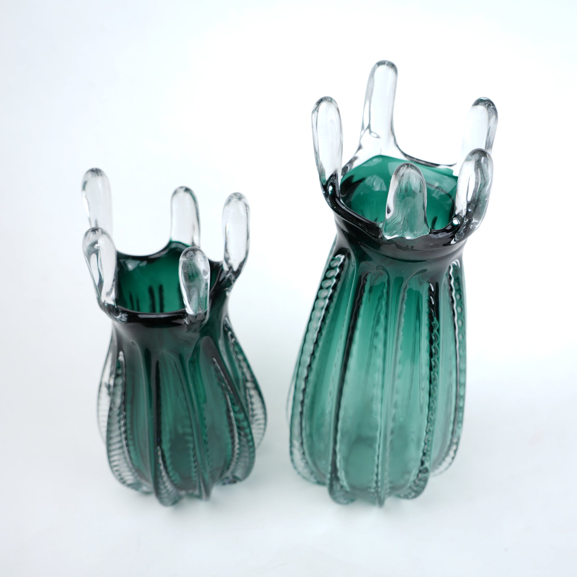 Emerald green glass vase with crown rim design available in small and big sizes for modern decor