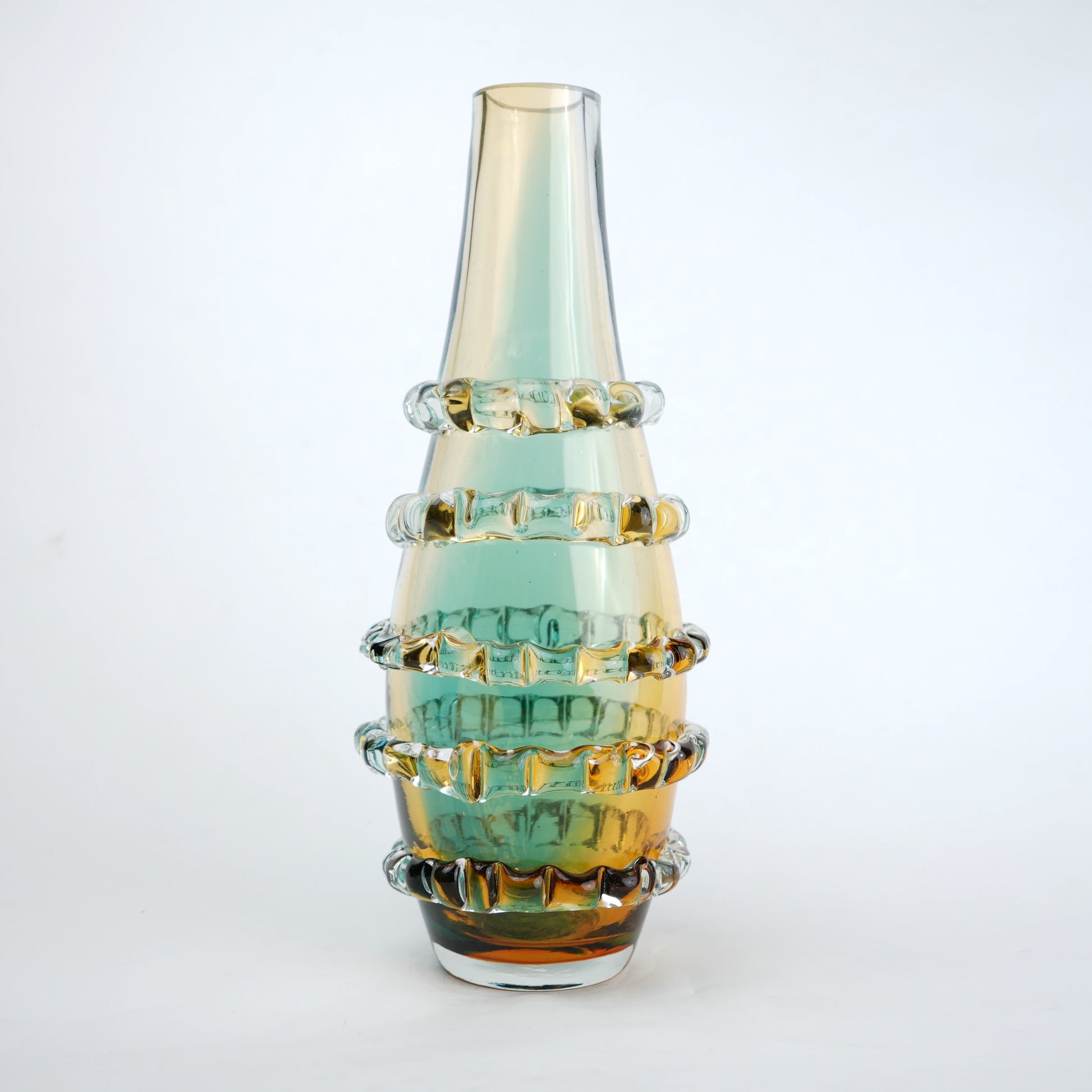 Amber and blue gradient glass vase with ribbed layered design and tall tapered shape