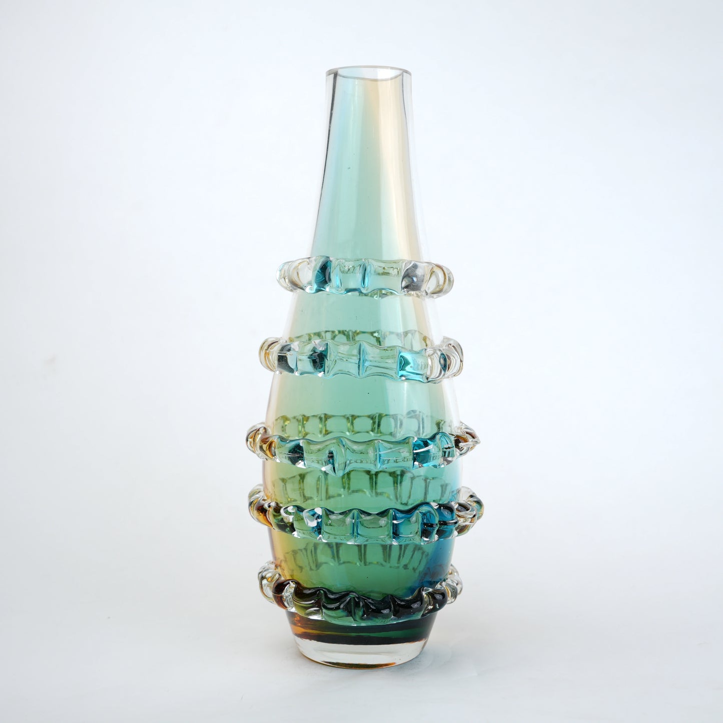 Amber and blue gradient glass vase with ribbed layered design and tall tapered shape