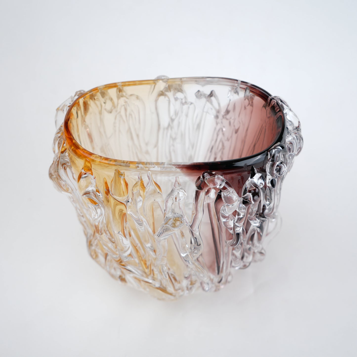 Dual tone glass vase with amber and rose tint and textured molten design in two sizes