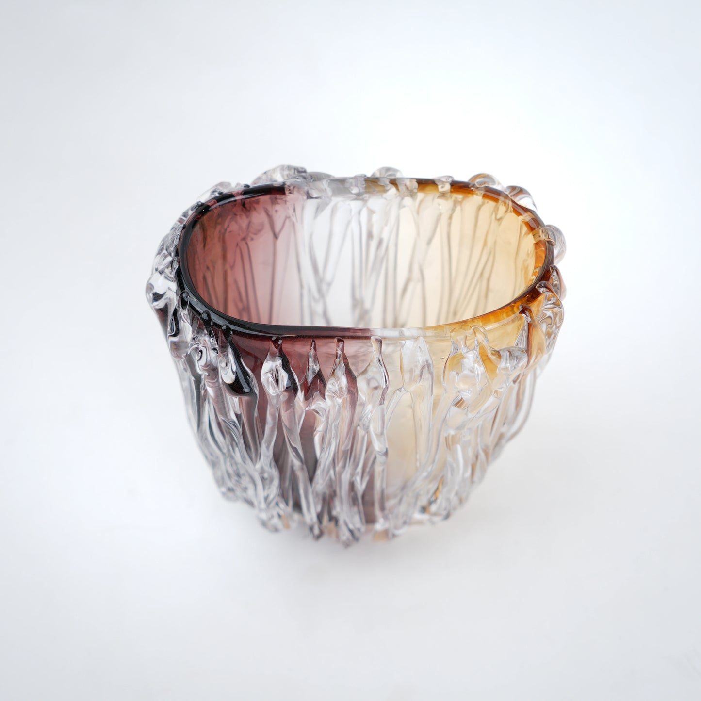 Dual tone glass vase with amber and rose tint and textured molten design in two sizes
