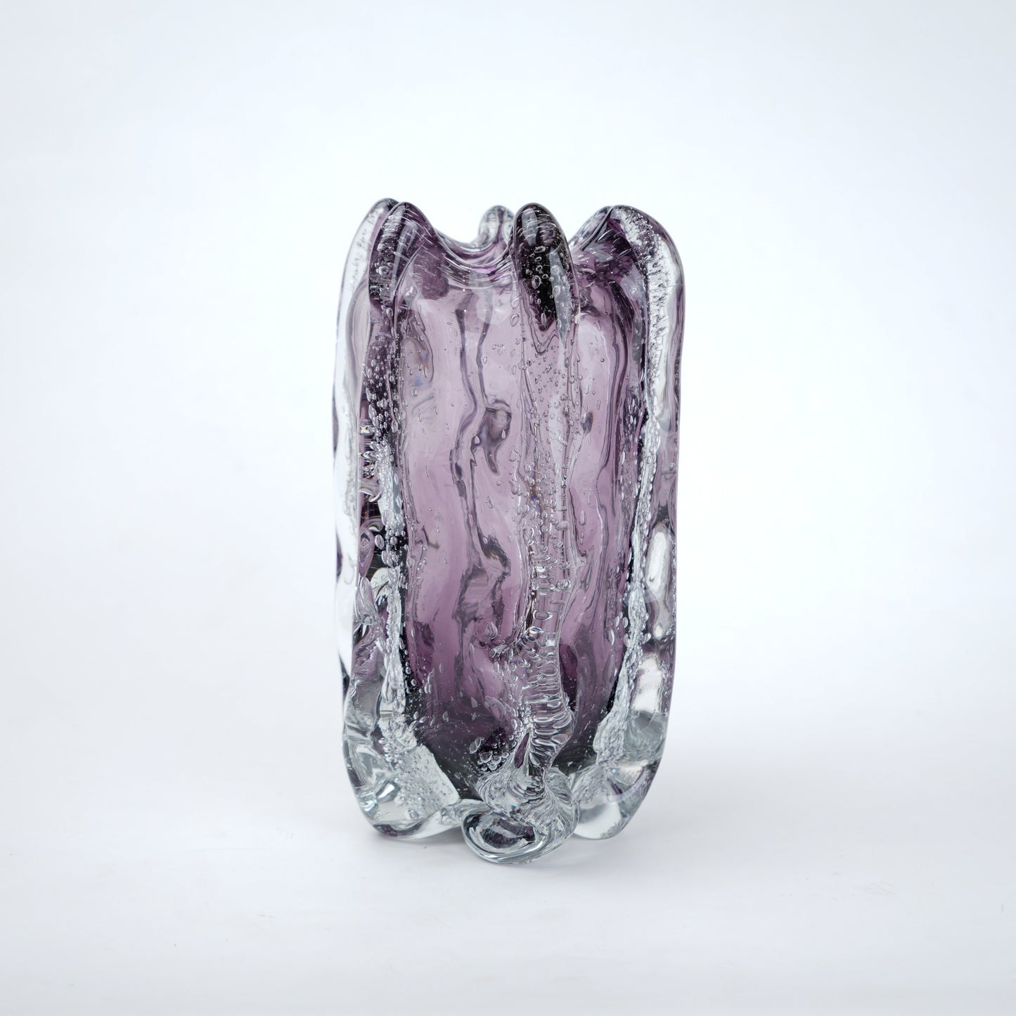 Purple and clear glass vase on a white background