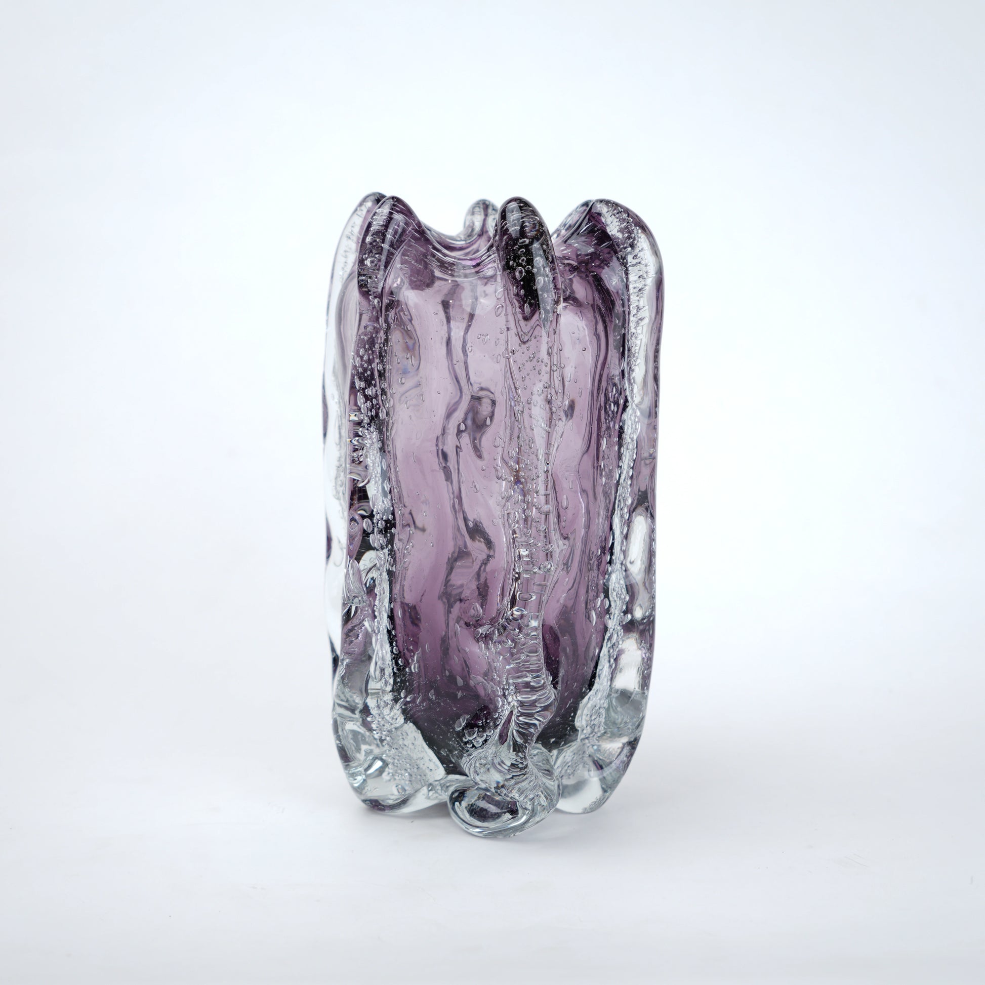 Purple and clear glass vase on a white background