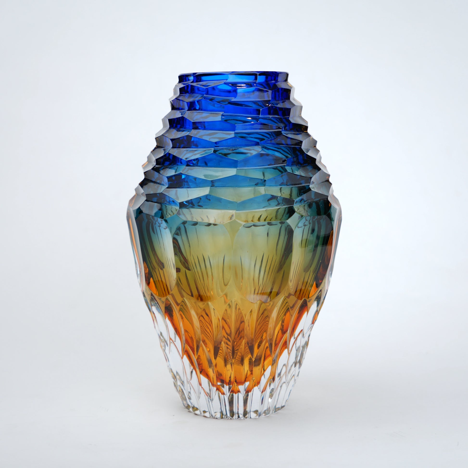 modern statement glass vase with blue and amber tones for interiors