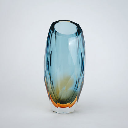 Decorative gradient glass vase with angular facets in blue and amber tones