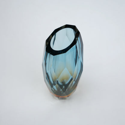 Decorative gradient glass vase with angular facets in blue and amber tones