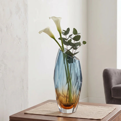 Decorative gradient glass vase with angular facets in blue and amber tones