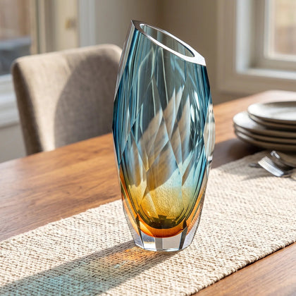 Decorative gradient glass vase with angular facets in blue and amber tones