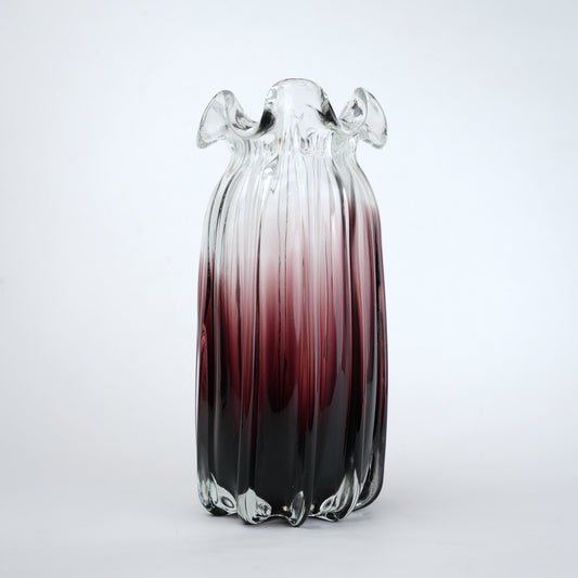 Blush and black ombre glass vase with ribbed texture and flared rim