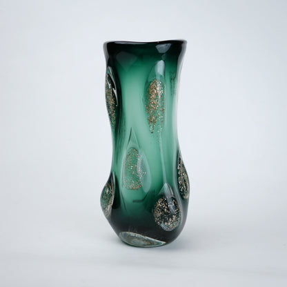 Textured green glass vase with sculpted surface and embedded shimmer accents in deep emerald tone with smooth glossy finish